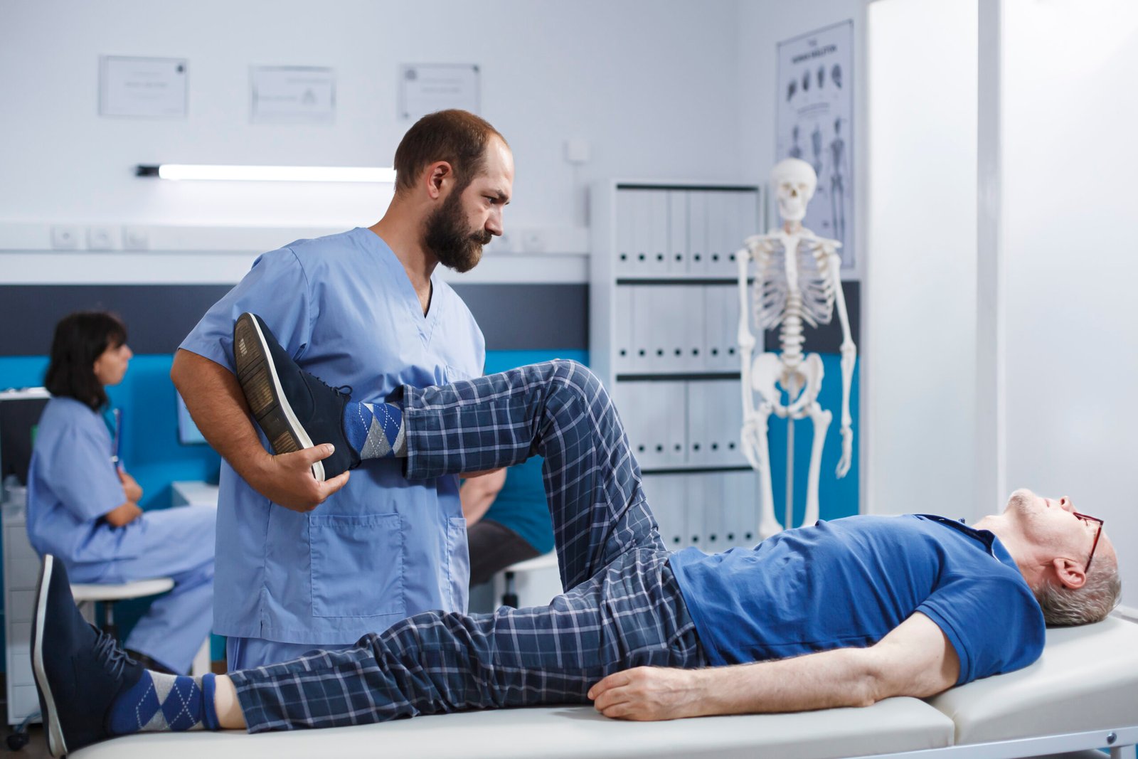 Chiropractor assisting a patient — postural assessment in a clinical setting